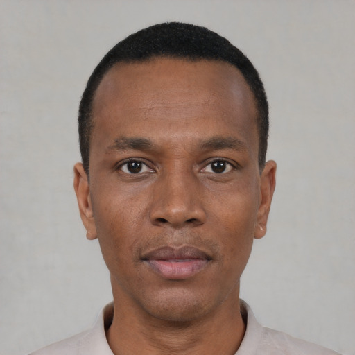 Neutral black young-adult male with short  black hair and brown eyes