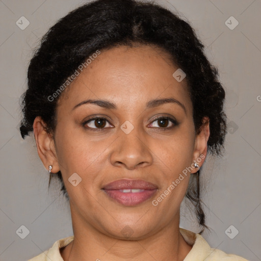 Joyful black adult female with medium  brown hair and brown eyes