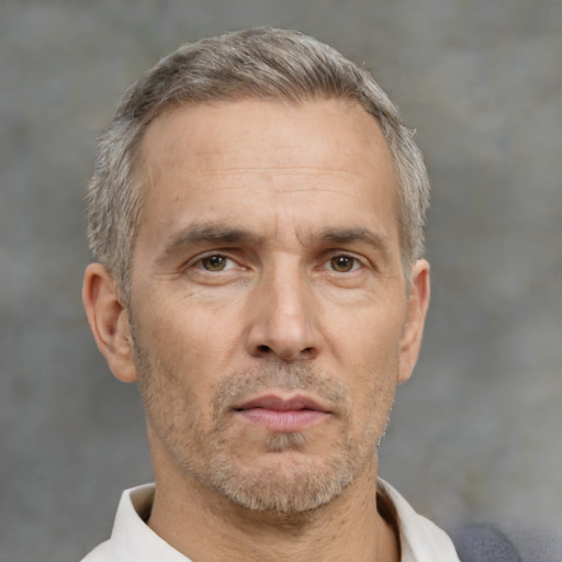 Neutral white middle-aged male with short  gray hair and brown eyes