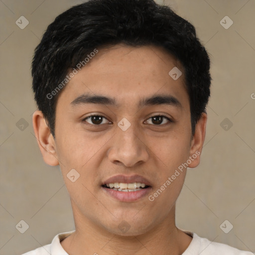 Joyful latino young-adult male with short  black hair and brown eyes