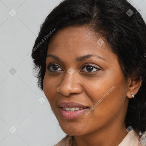 Joyful black young-adult female with long  brown hair and brown eyes