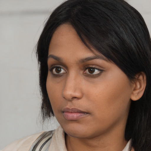 Neutral asian young-adult female with long  brown hair and brown eyes