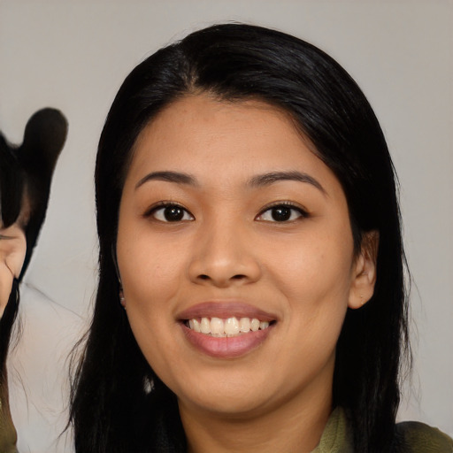 Joyful asian young-adult female with medium  black hair and brown eyes