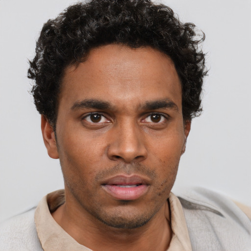 Neutral black young-adult male with short  brown hair and brown eyes