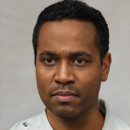 Neutral black young-adult male with short  black hair and brown eyes