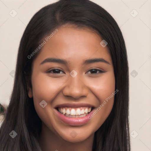 Joyful latino young-adult female with long  brown hair and brown eyes