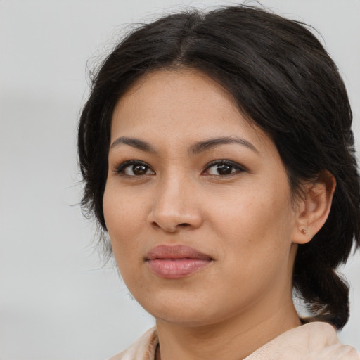 Joyful asian young-adult female with medium  brown hair and brown eyes
