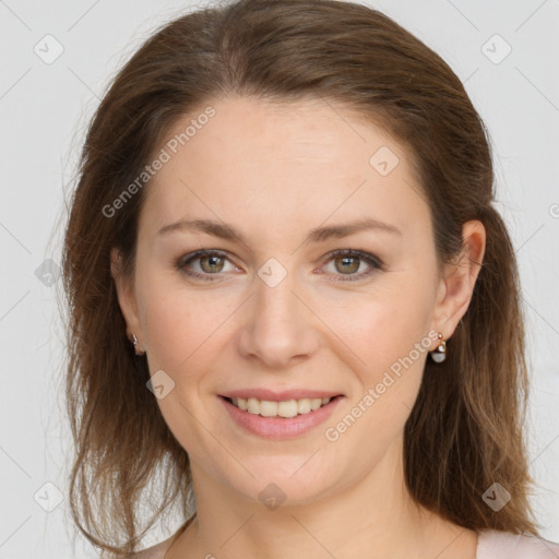 Joyful white young-adult female with long  brown hair and grey eyes