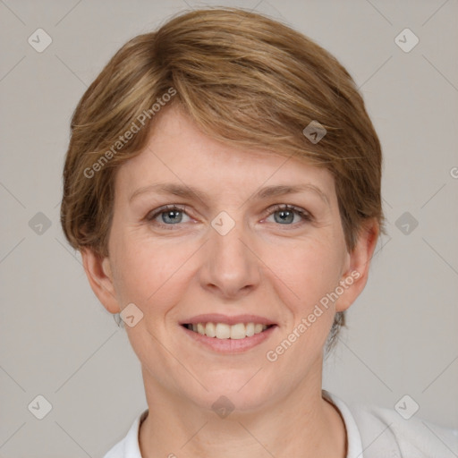 Joyful white adult female with short  brown hair and grey eyes