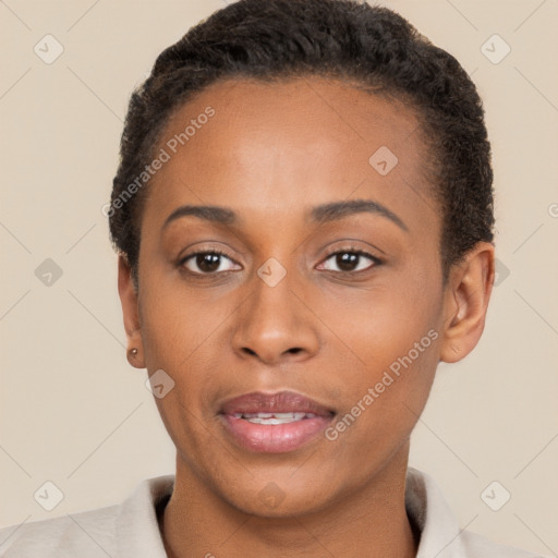 Joyful black young-adult female with short  brown hair and brown eyes