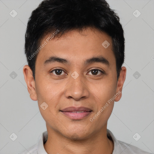 Joyful latino young-adult male with short  black hair and brown eyes