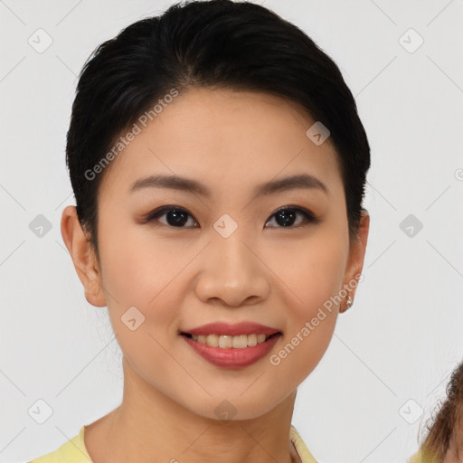 Joyful asian young-adult female with short  brown hair and brown eyes