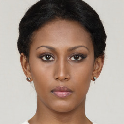 Neutral black young-adult female with short  brown hair and brown eyes