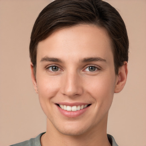 Joyful white young-adult female with short  brown hair and brown eyes