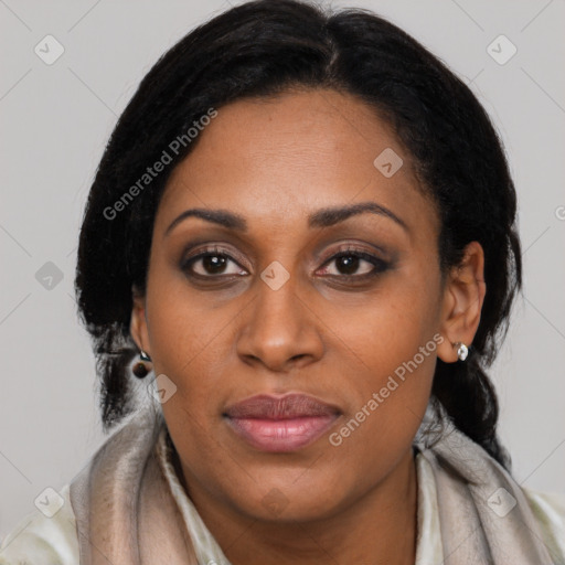 Joyful latino young-adult female with long  black hair and brown eyes