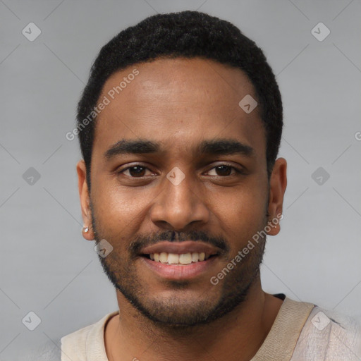 Joyful black young-adult male with short  black hair and brown eyes
