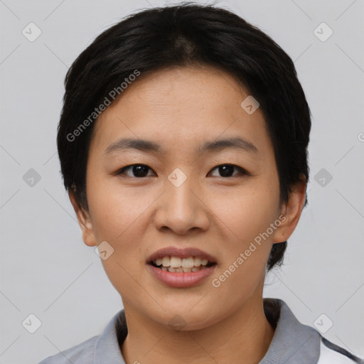 Joyful asian young-adult female with short  black hair and brown eyes