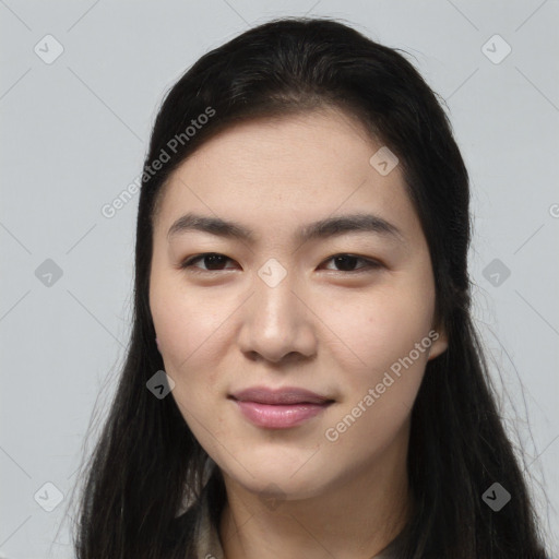 Joyful asian young-adult female with long  brown hair and brown eyes