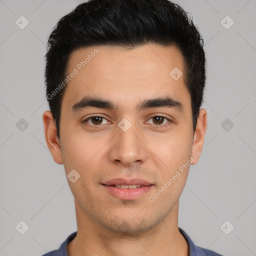 Joyful white young-adult male with short  black hair and brown eyes