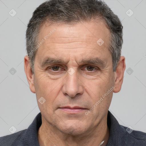 Neutral white middle-aged male with short  brown hair and brown eyes