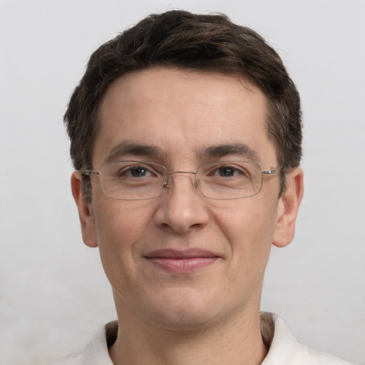 Joyful white adult male with short  brown hair and grey eyes