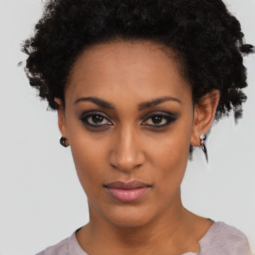 Neutral black young-adult female with short  black hair and brown eyes