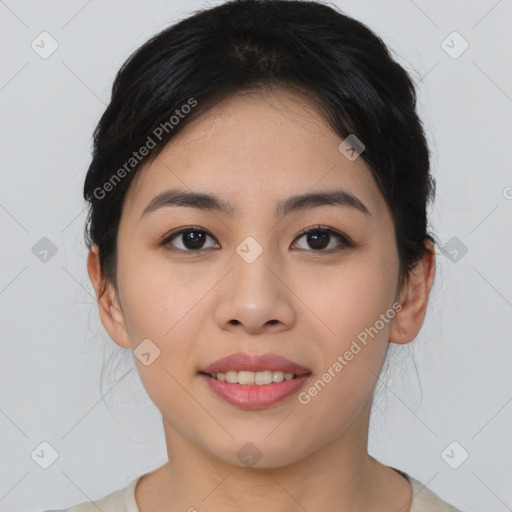 Joyful asian young-adult female with medium  black hair and brown eyes