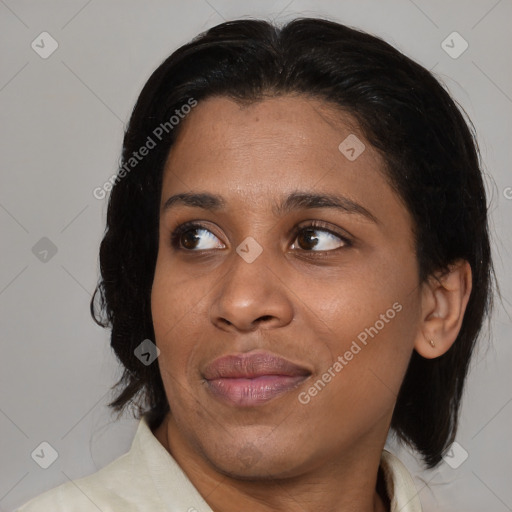 Joyful black young-adult female with medium  black hair and brown eyes
