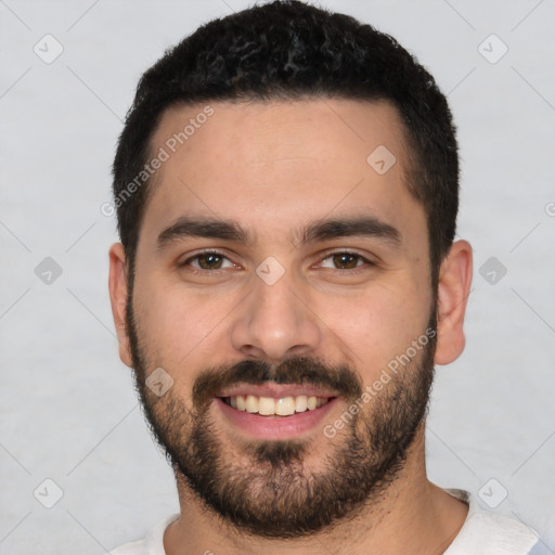 Joyful white young-adult male with short  black hair and brown eyes