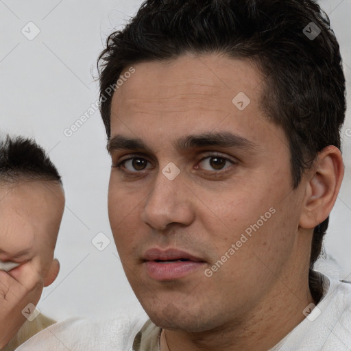 Neutral white young-adult male with short  brown hair and brown eyes