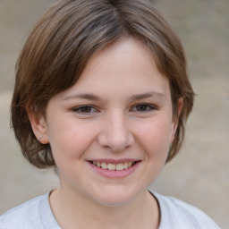 Joyful white child female with medium  brown hair and brown eyes