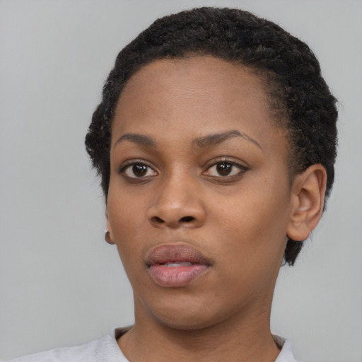 Neutral black young-adult female with short  black hair and brown eyes