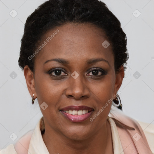 Joyful black adult female with short  brown hair and brown eyes