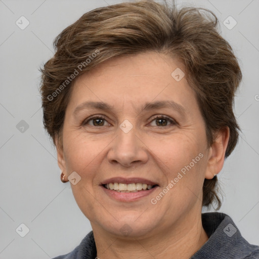 Joyful white adult female with short  brown hair and brown eyes