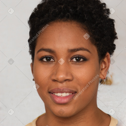 Joyful black young-adult female with short  brown hair and brown eyes