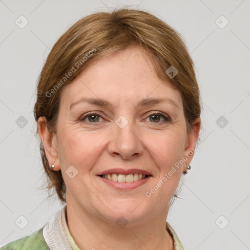 Joyful white adult female with medium  brown hair and grey eyes