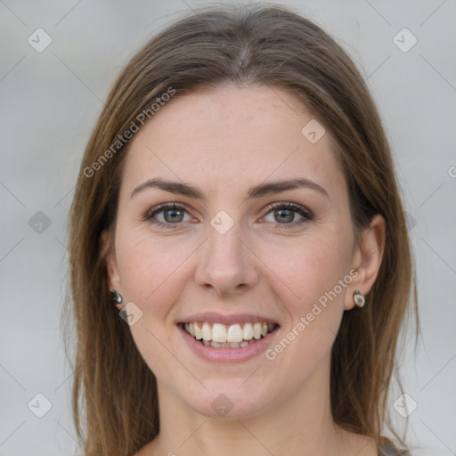 Joyful white young-adult female with long  brown hair and grey eyes