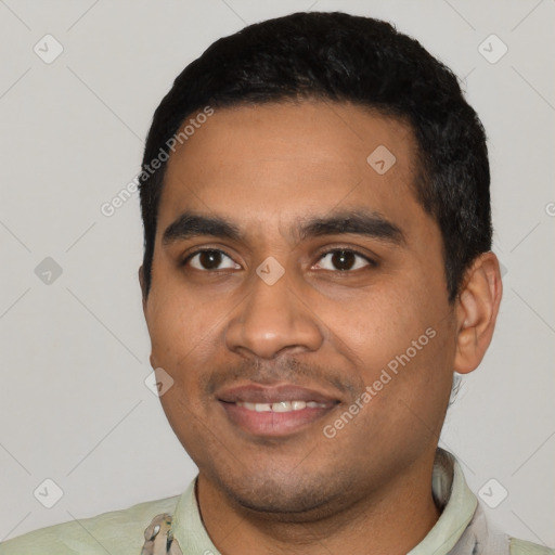 Joyful latino young-adult male with short  black hair and brown eyes