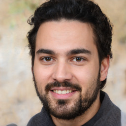 Joyful white young-adult male with short  black hair and brown eyes