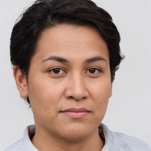 Joyful white young-adult female with short  brown hair and brown eyes