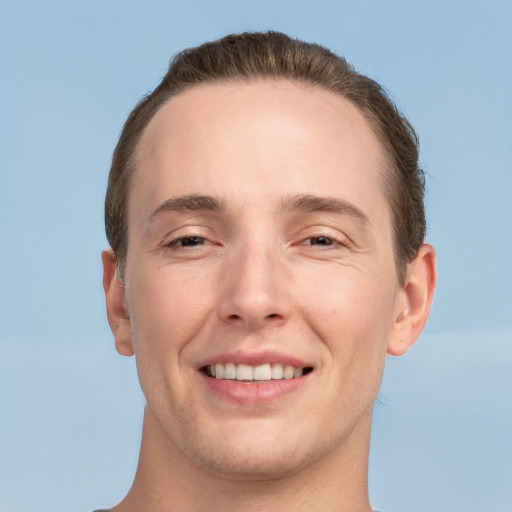 Joyful white adult male with short  brown hair and grey eyes