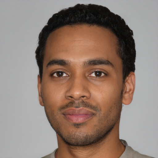 Neutral black young-adult male with short  black hair and brown eyes