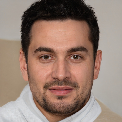 Joyful white young-adult male with short  brown hair and brown eyes