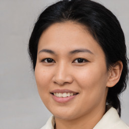 Joyful asian young-adult female with medium  brown hair and brown eyes