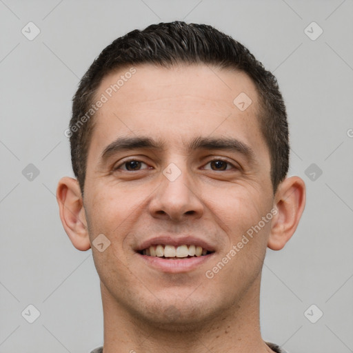 Joyful white young-adult male with short  brown hair and brown eyes