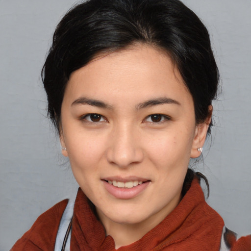 Joyful white young-adult female with medium  brown hair and brown eyes
