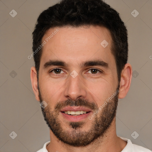 Joyful white young-adult male with short  black hair and brown eyes