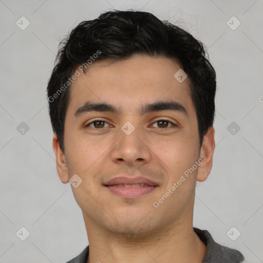 Joyful asian young-adult male with short  black hair and brown eyes