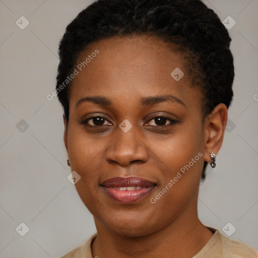 Joyful black young-adult female with short  brown hair and brown eyes