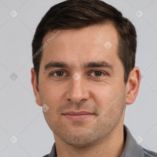 Joyful white adult male with short  brown hair and brown eyes